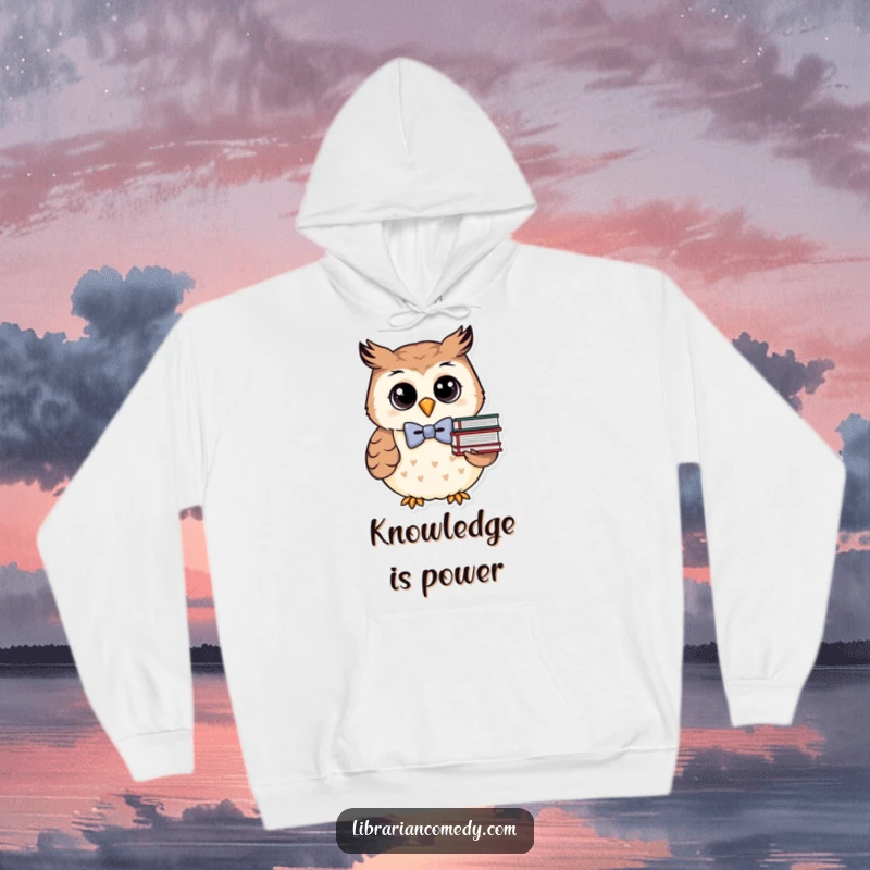 Funny owl in bowtie with books on a cozy hoodie, indicating warmth and love for reading, a perfect gift.