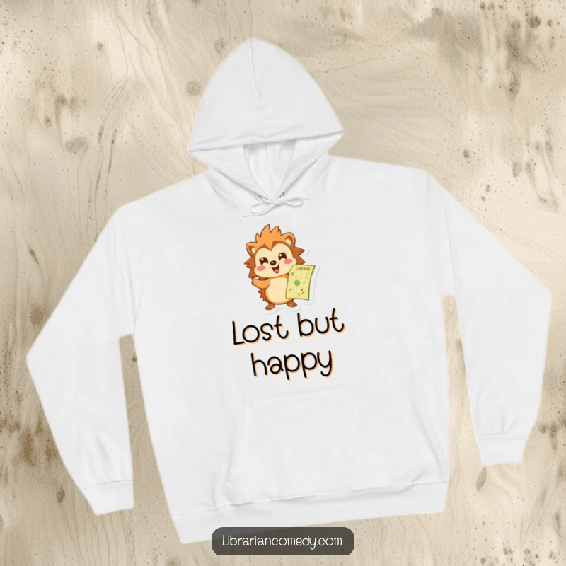 Funny hedgehog hoodie showing a cheerful hedgehog pointing at a library map, perfect for cozy exploration and literary adventures.