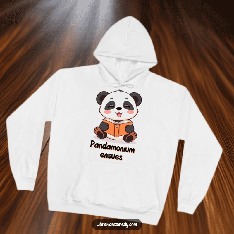 Funny giggling panda reading a book upside down on a cozy hoodie, indicating warmth and quirky reading habits, a funny gift.